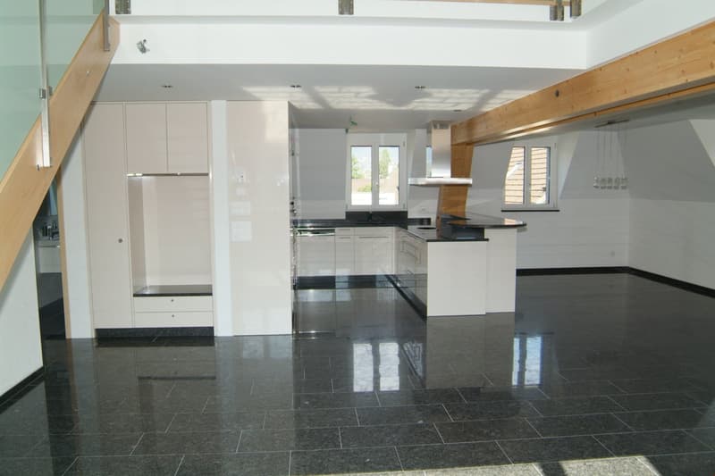 kitchen, white cupboards, granite floor, ceiling lights, large windows, black counter