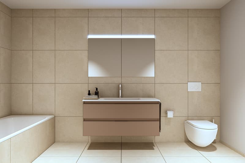 Modern bathroom with white walls, beige tiles, bathtub, wall-mounted vanity with sink and mirrored cabinet, built-in toilet