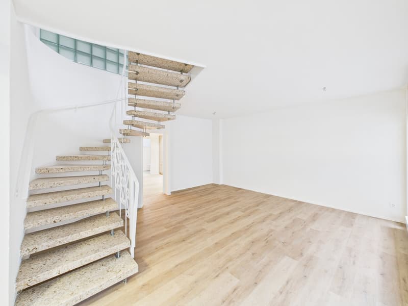 modern staircase with concrete steps, white handrail, beige floor