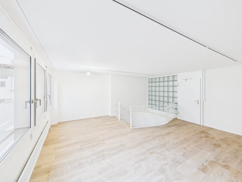 wooden floor, modern staircase, sliding glass doors, radiator, ceiling lamp