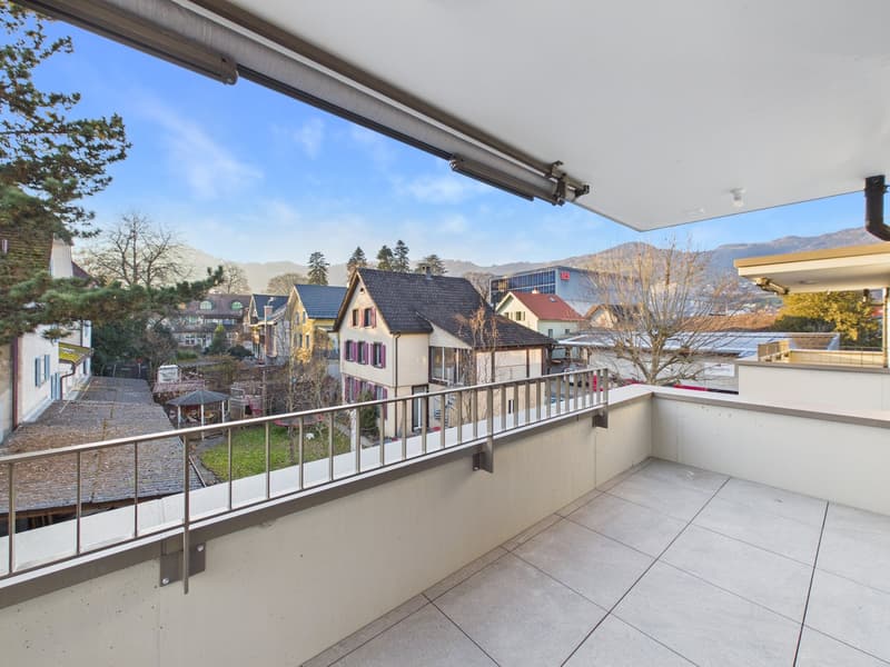 large balcony, city view, empty, white tiles, metal railing