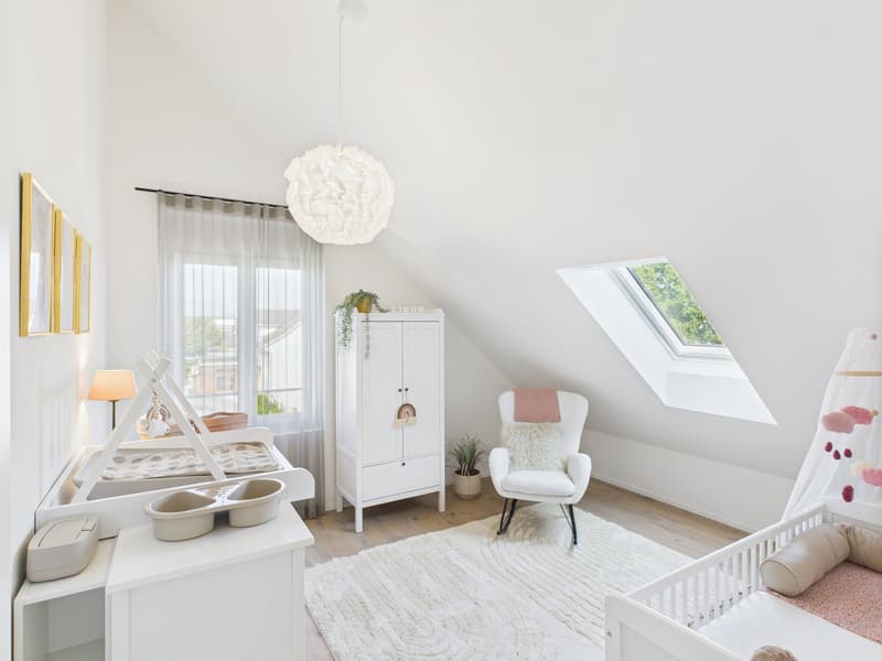 white walls, wooden floor, white furniture, crib, changing table, white rug, white cabinet, skylight, decorative items