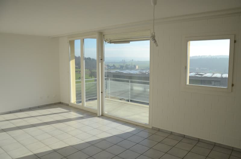 empty room, large glass windows, sliding doors, tiled floor, balcony
