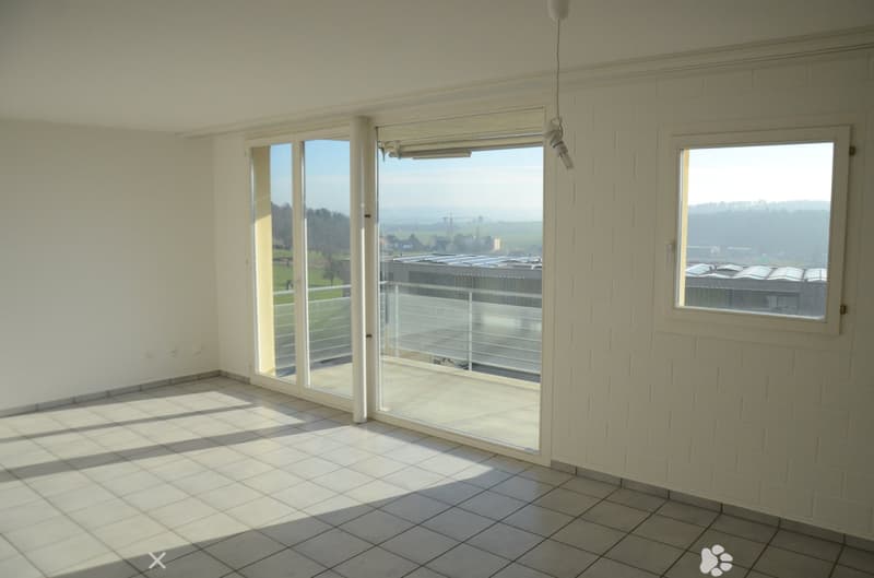 empty room, large glass windows, sliding doors, tiled floor, balcony