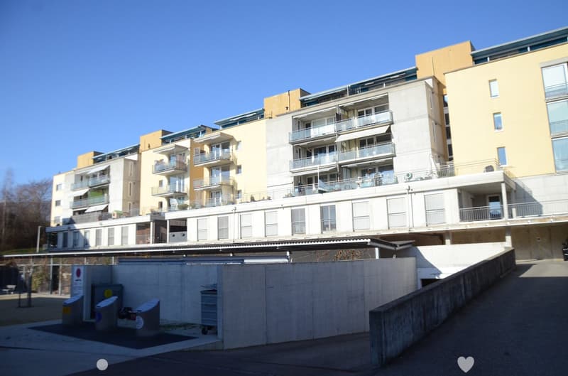 multiple story apartment building, balconies, yellow and white paint
