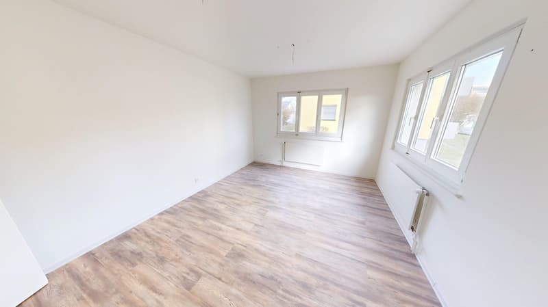 empty room, wooden floor, white walls, 2 windows