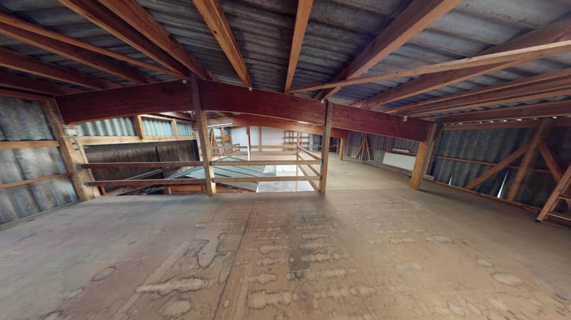 wooden beams, wooden flooring, large open space, metal ceiling
