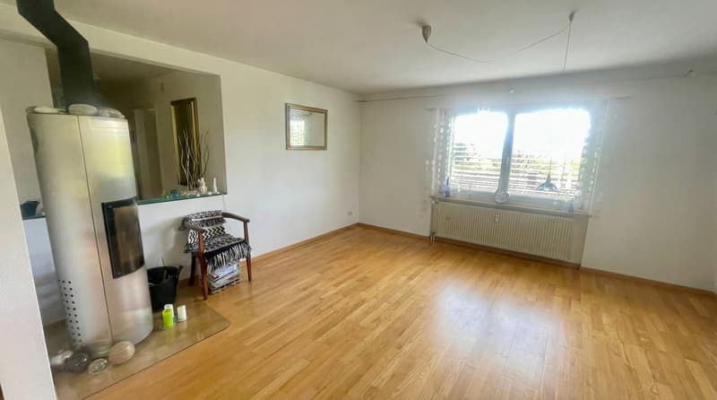 Fireplace, wooden floor, white walls, empty room, chair, radiator