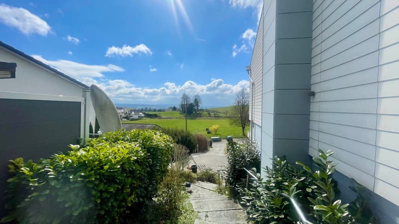 garden with stairs and view of a green field