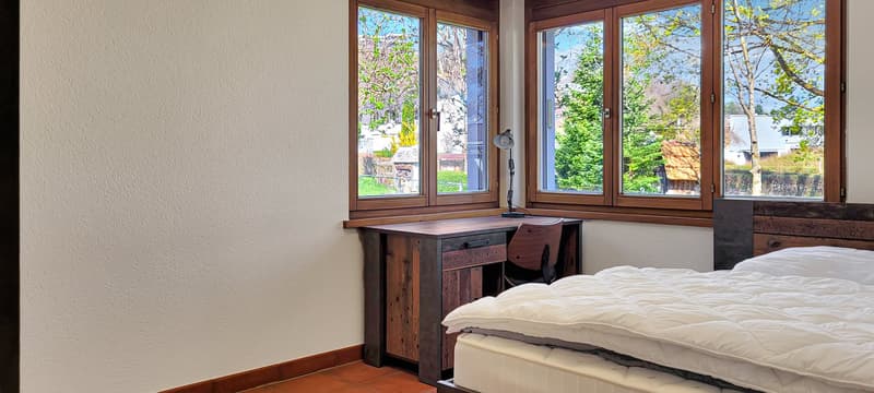 wooden desk, bed, lamp, windows