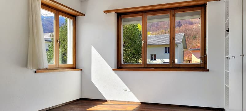 two large windows, mountain view