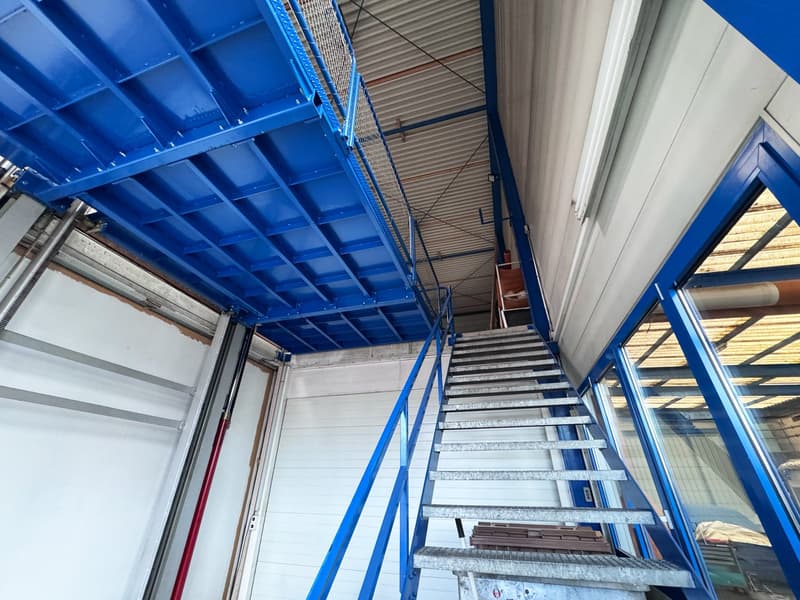 interior, staircase with blue handrail, white walls, metal ceiling