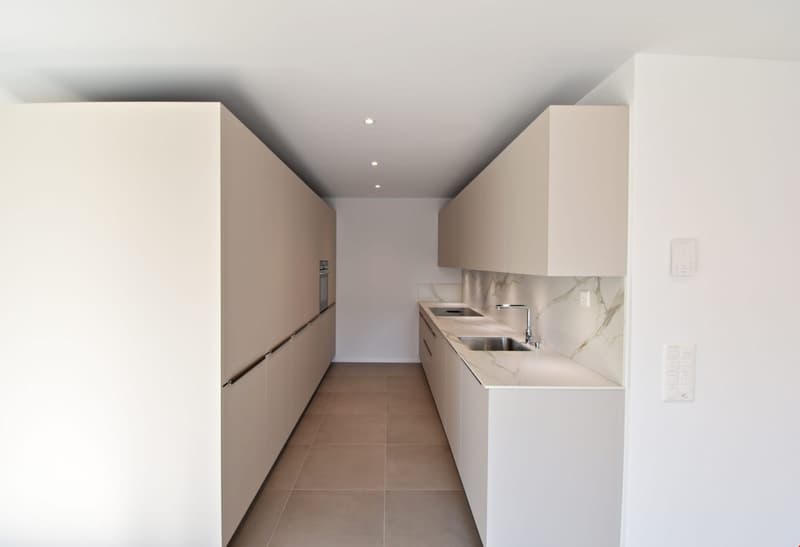 modern kitchen, white cabinets, marble countertops, stainless steel sink, faucet, tiled floor