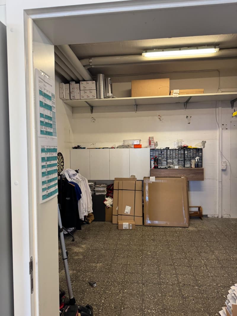 Storage room with boxes, shelves, and a dartboard
