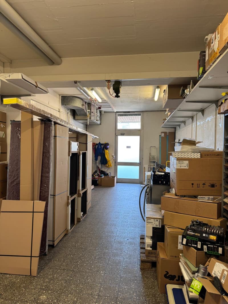 Storage room with boxes, shelves, and equipment