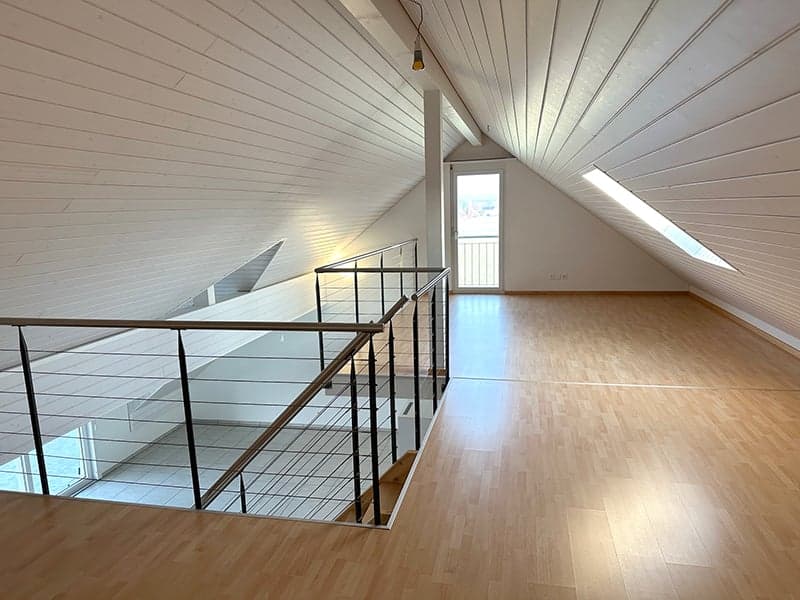 empty room, wooden floor, white walls, metal railing, glass door, windows