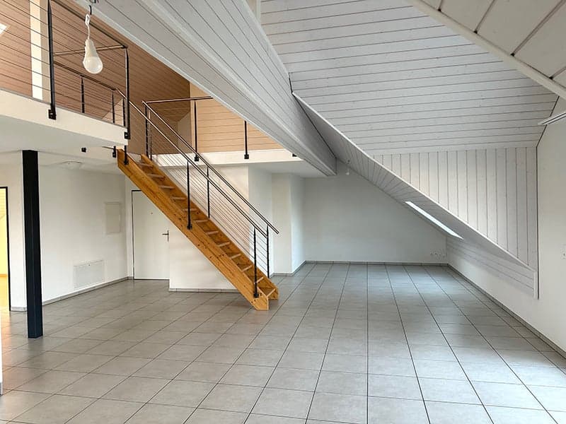 empty room, wooden stairs, white walls, tiled floor, metal railings, balcony