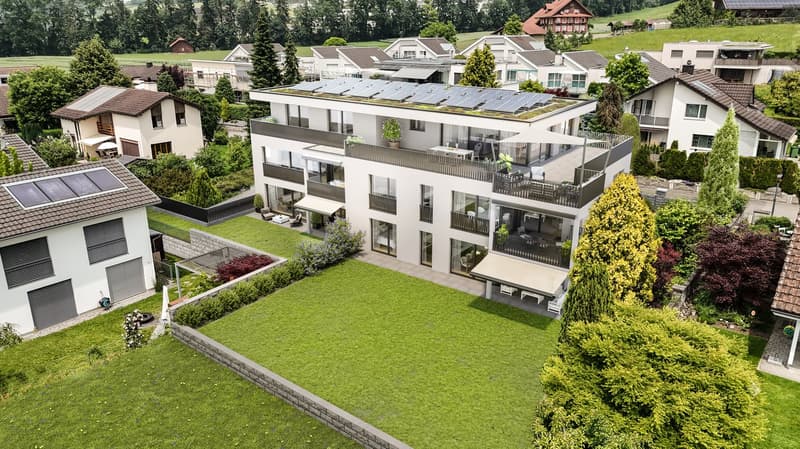 3 story apartment, solar panels, balconies, lawn, garden