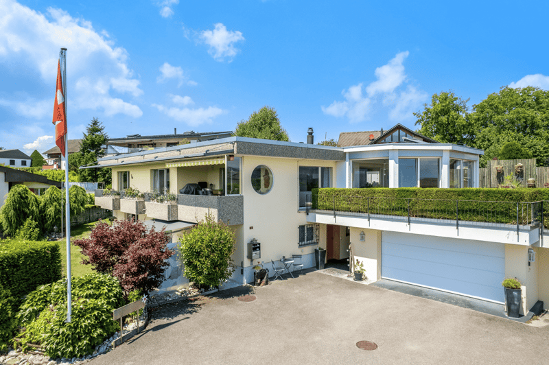2 story house, terrace, balcony, garage, driveway, plants and shrubs