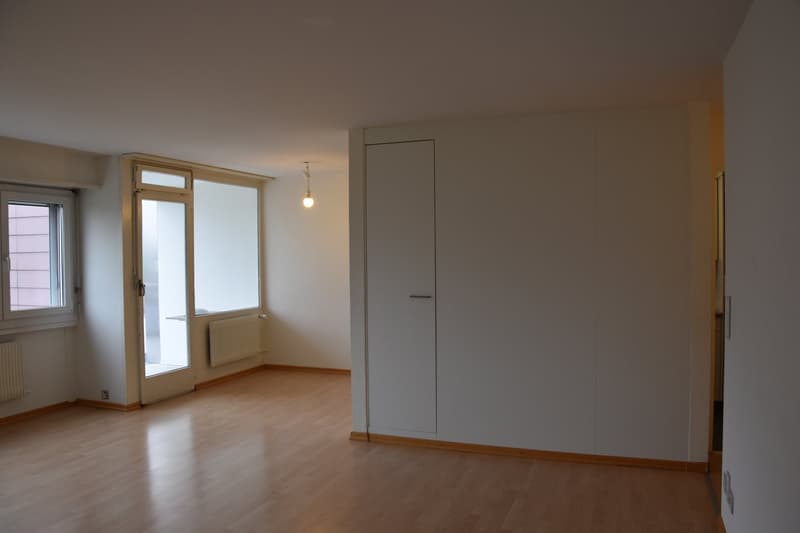 empty room, wooden floor, sliding door, radiators, wardrobe