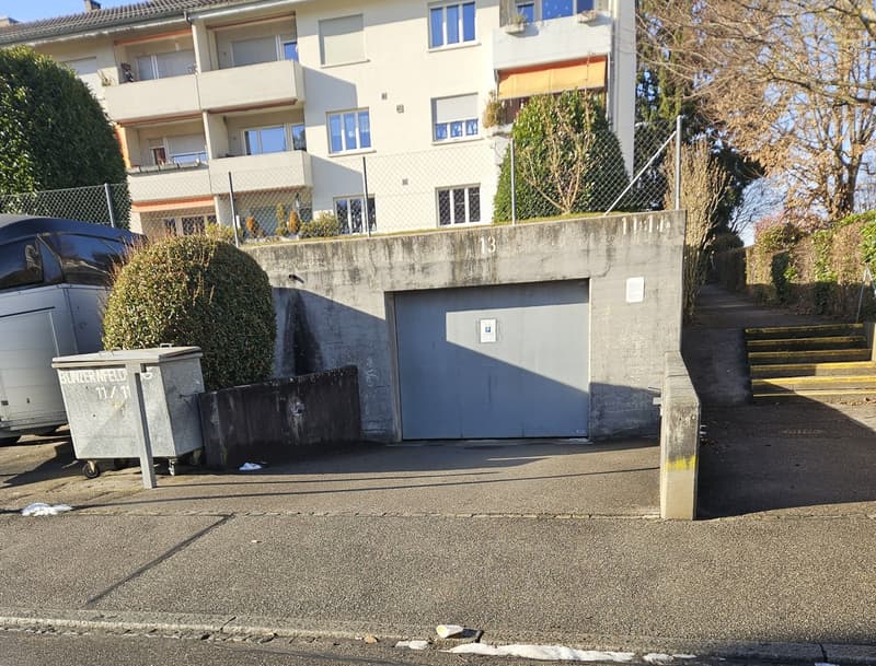 concrete wall, parking area, concrete garage door, storage bins