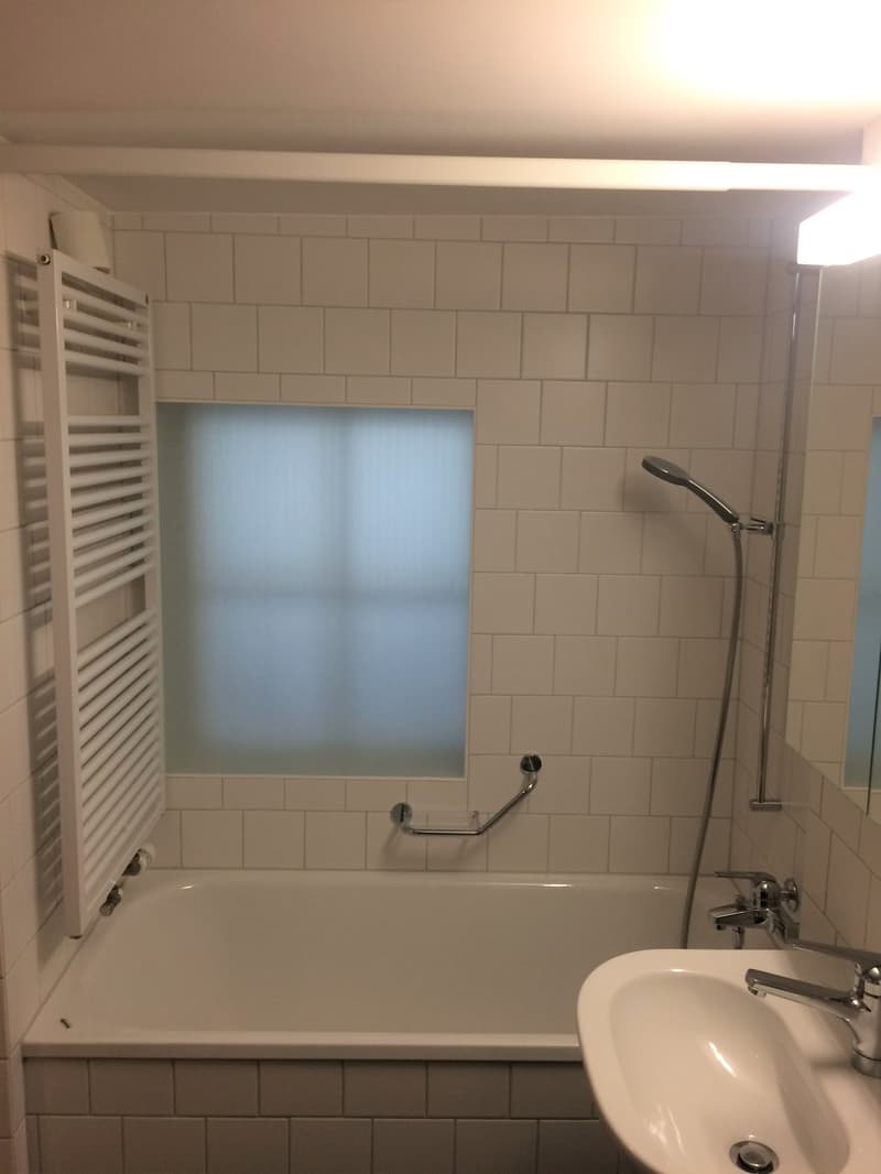 modern white bathroom, bathtub, shower, sink, mirror, white tiles