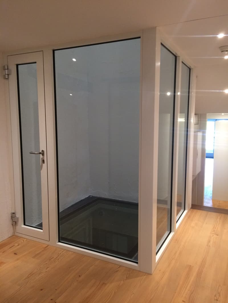 glass walls, floor opening, wooden floor