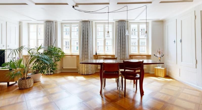 dining room, wooden floor, large windows, dining table, chairs, plants, radiators, pendant lights