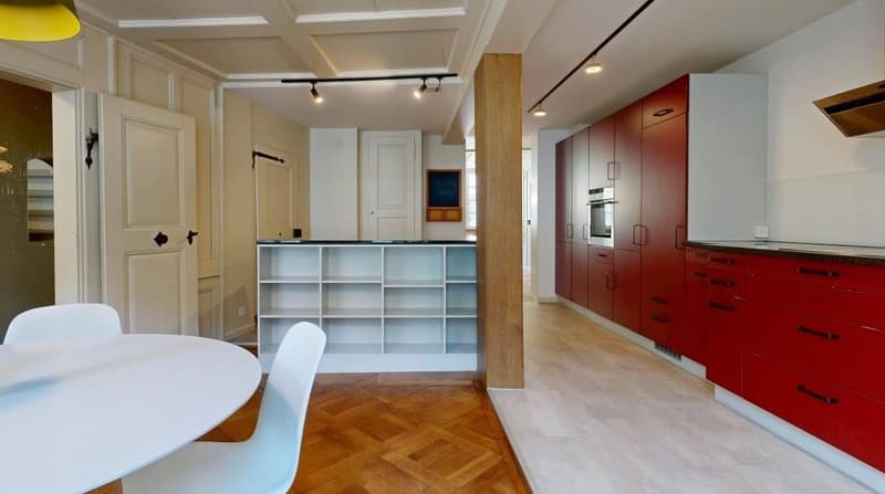 modern kitchen with wooden floor, white shelves, red cabinets, white dining table, white chairs