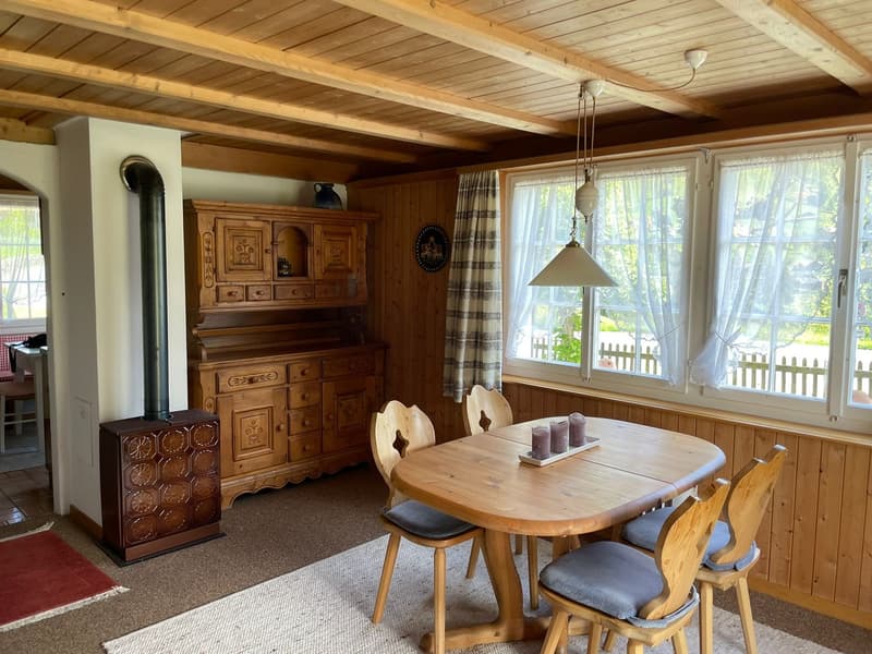 wooden walls, wooden dining table, wooden chairs, kitchen, fireplace