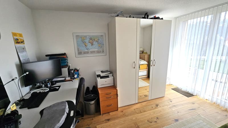 desk, computer, printer, chair, cabinet, map, rug, wardrobe