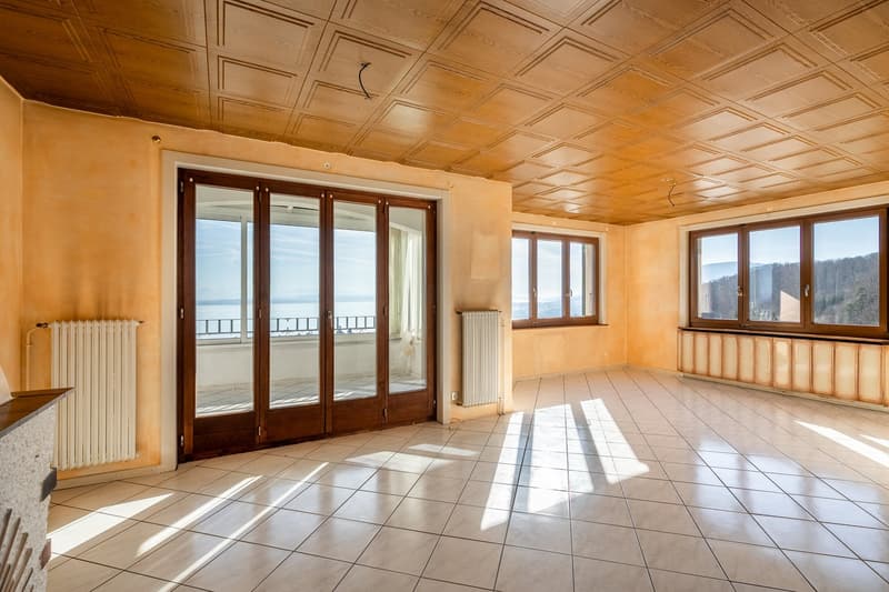 modern room with white tiles, yellow walls, glass doors with balcony, windows, wooden ceiling, radiator
