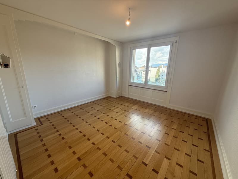 empty room, wooden floor, white walls, large window, bright light