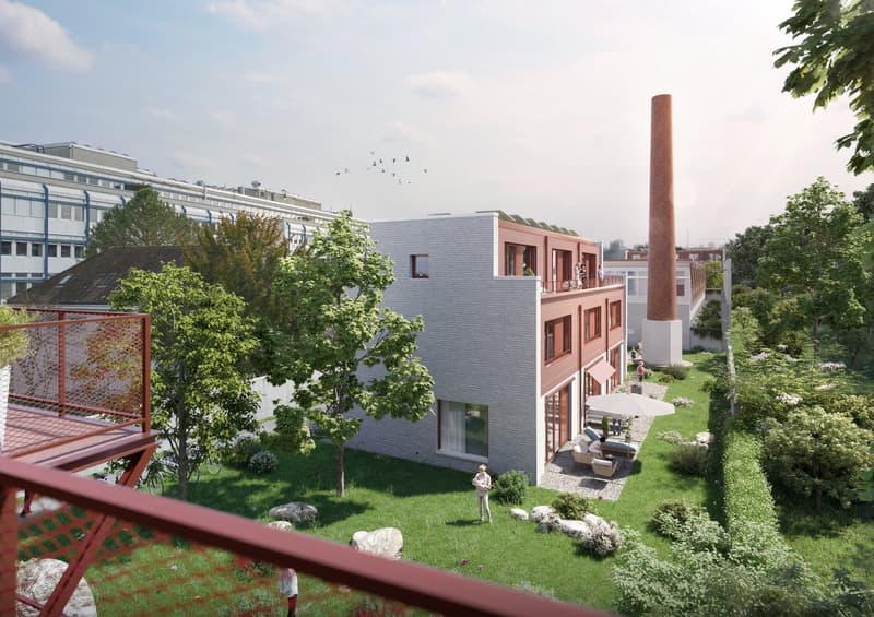 Modern building with brick facade, solar panels, terrace, garden, and outdoor seating area