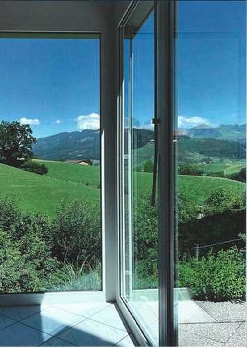 sliding glass doors, balcony, tiled floor, view of green field and mountains