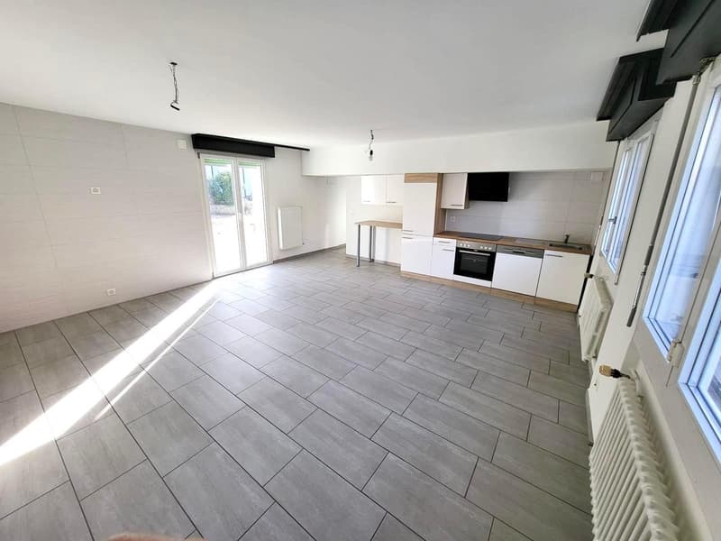 empty room, white walls, gray tiles, kitchen with oven and sink, windows, sliding door