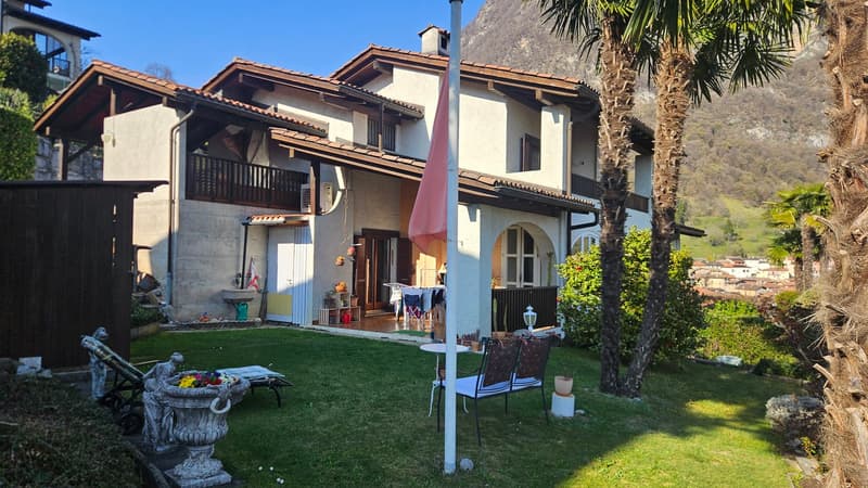 2 story house, brown roof, white walls, balcony, garden, patio, mountain view