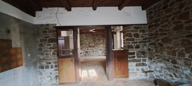 Stone walls, wooden doors, wooden ceiling, tiled floor