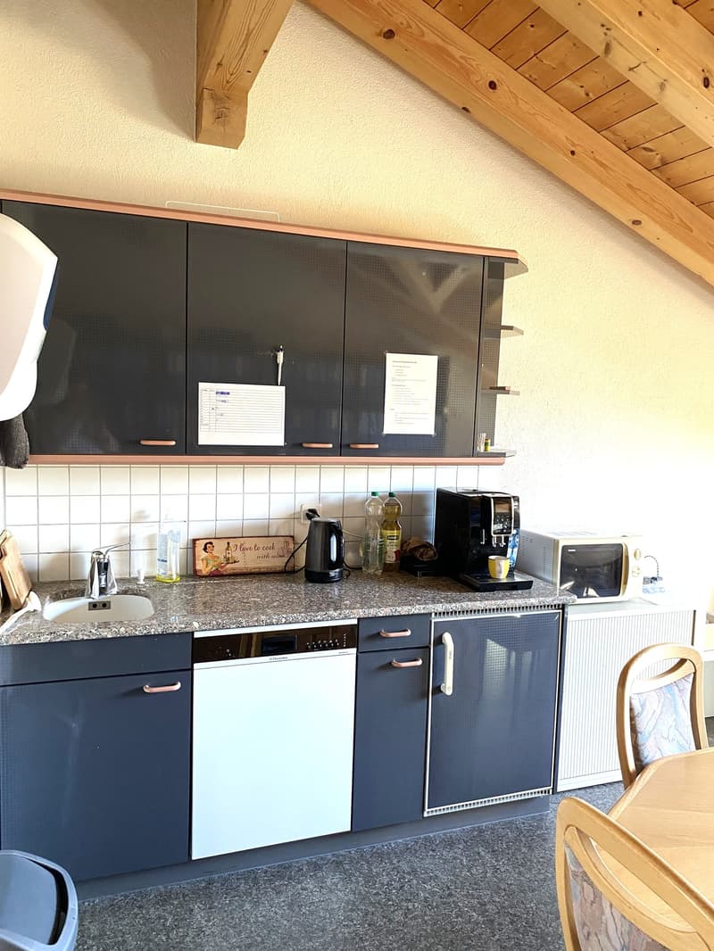 kitchen with granite countertop, sink, dishwasher, coffee machine, microwave, cabinets, wooden ceiling