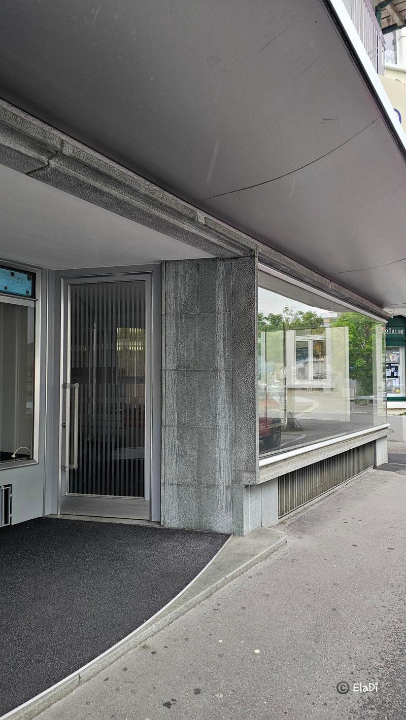 modern building, glass facade, concrete exterior, entrance door