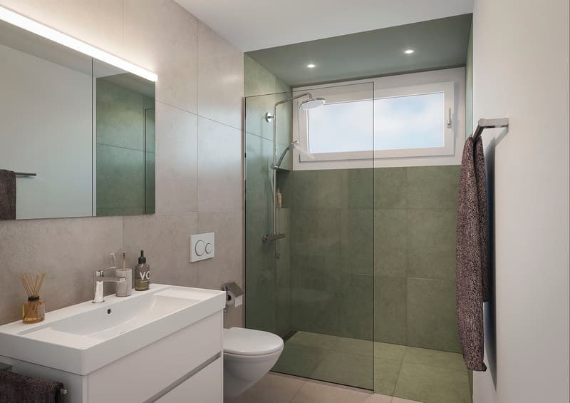 modern bathroom with white sink, white toilet, glass shower enclosure, green tiles, mirror, towel rack, toiletries
