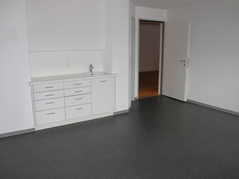 empty room, white walls, open door, white sink, wooden floor, open door