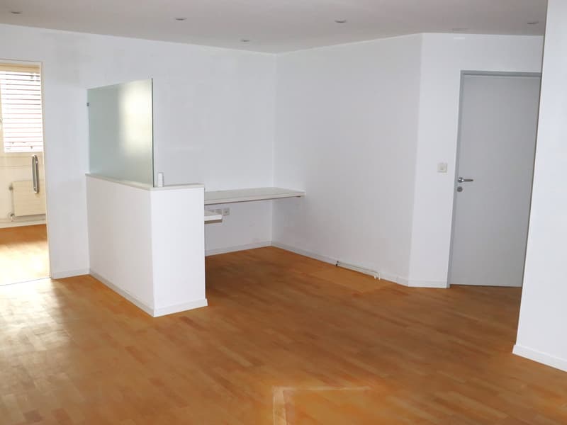 empty room, white walls, white countertop, wooden floor, glass partition, doors