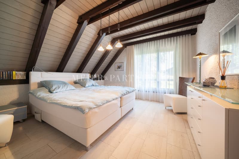 white wooden bed, blue pillows, white bedding, white furniture, floor lamps, wooden ceiling, white curtains