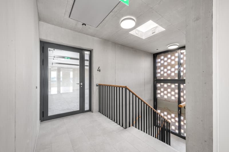 Staircase with railings leading to an upper floor, tiled floor, glass doors, wall-mounted lamps, number 4