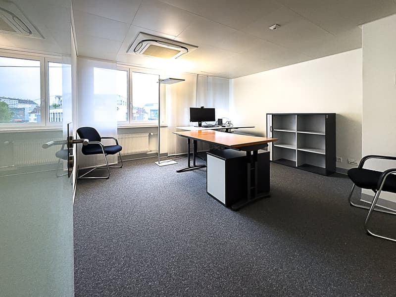 Desk, computer, chair, shelf, windows, radiator
