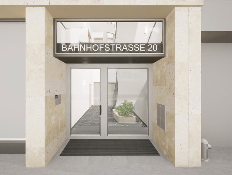 Reception area with sliding glass doors, a potted plant, a mat at the entrance, a trash bin, and a building with a staircase visible in the background.