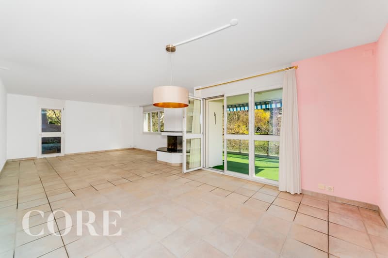 empty room, fireplace, sliding glass doors, balcony, tiled floor, white walls, pink wall