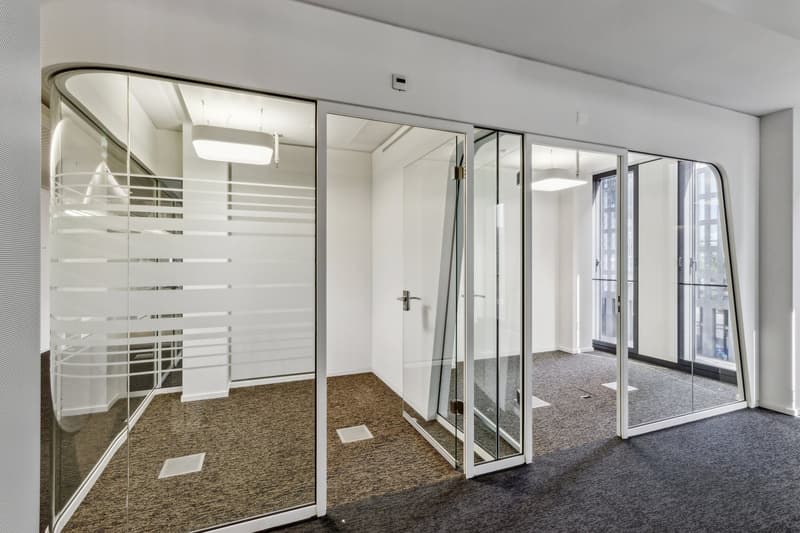 glass walls, doors, floor, ceiling, lights, carpeted floor