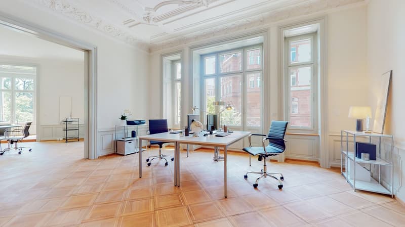 office room with large desk, chairs, lamps, shelves, monitor, keyboard, mouse, printer, glass wall